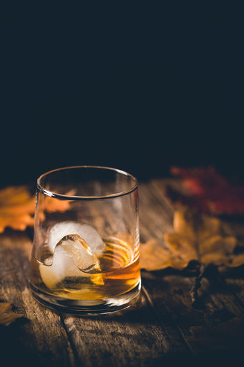 Close-up of beer glass on table