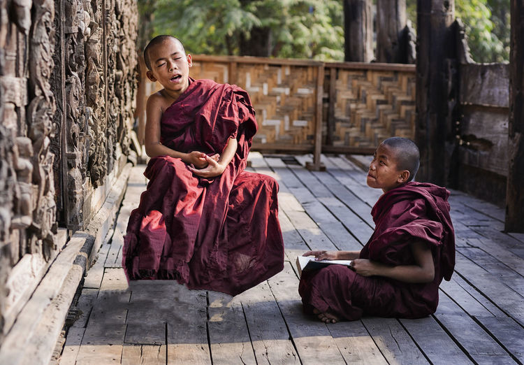 Monks sitting in temple