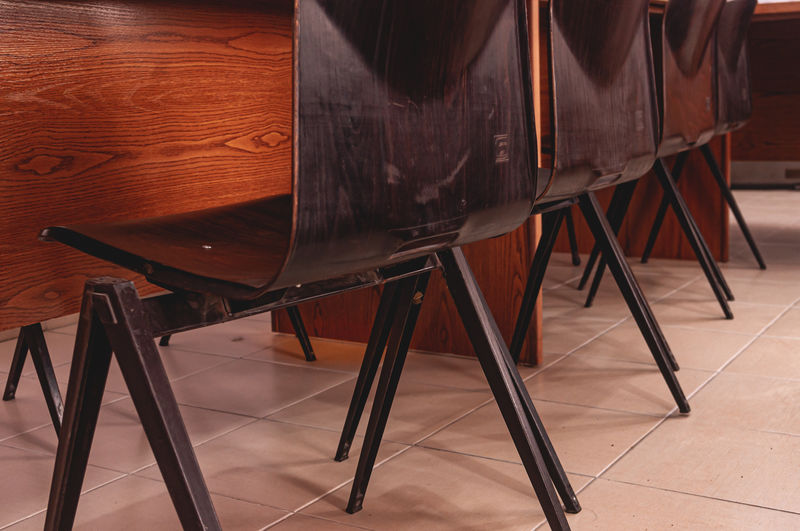 High angle view of chairs on table
