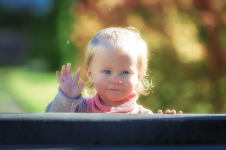 Portrait of cute baby girl outdoors