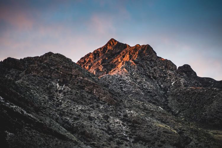 Scenic view of rocky mountains against sky