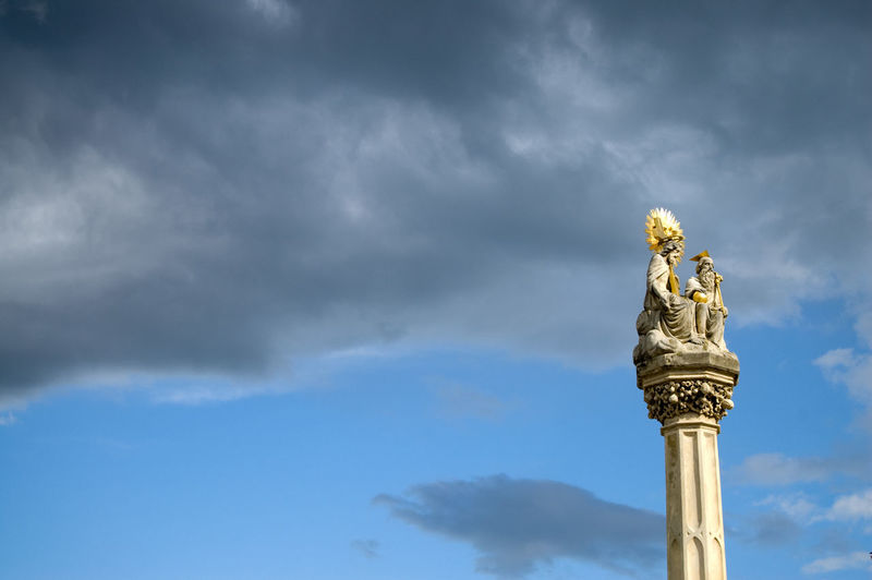 Low angle view of statue with sky in background