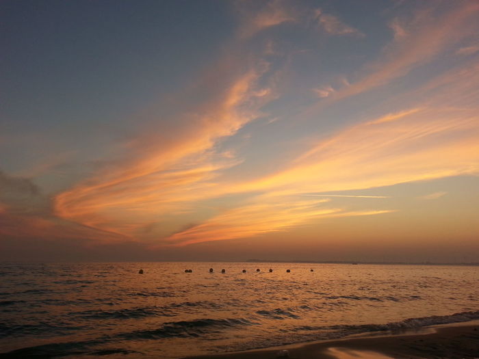 Scenic view of sea at sunset