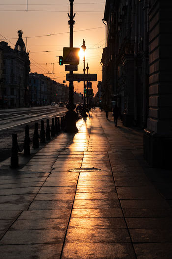Footpath at street during sunset