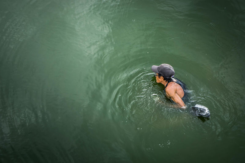 High angle view of man swimming in lake