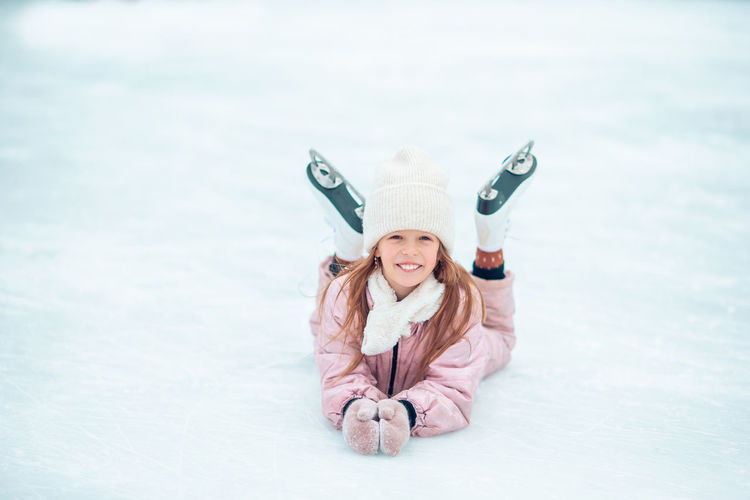 Portrait of smiling girl in snow