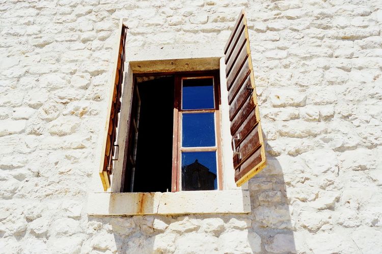 Low angle view of open window