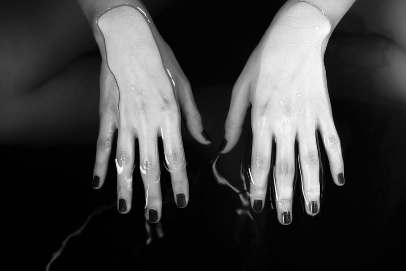 Close-up of human hand in water