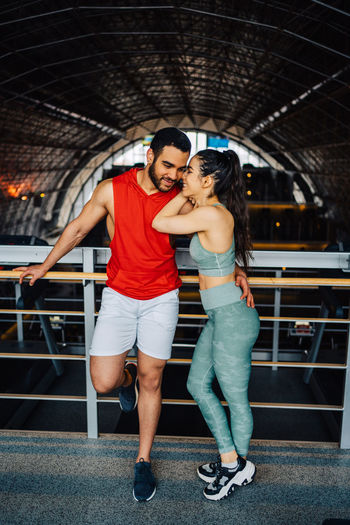 Portrait of young couple in love having a special moment in gym clothes