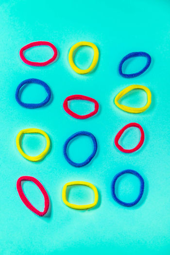 Directly above shot of multi colored candies against blue background