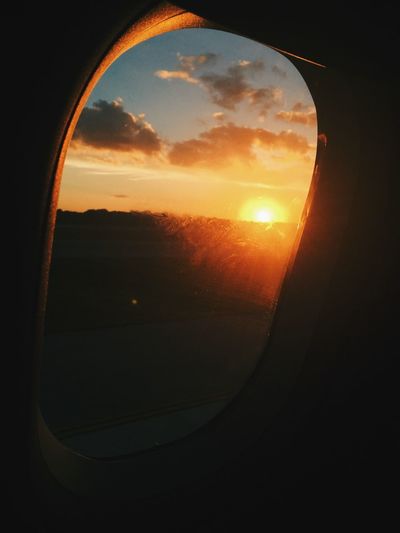 Sunset seen through airplane window