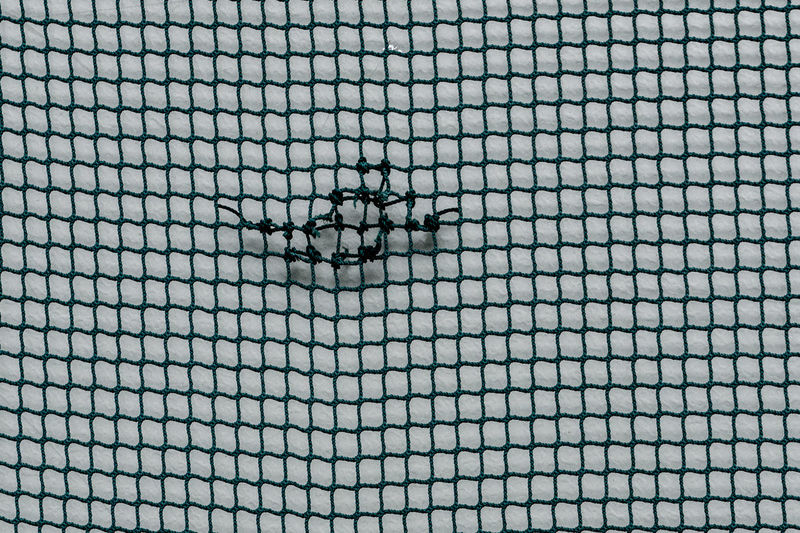Full frame shot of net against wall