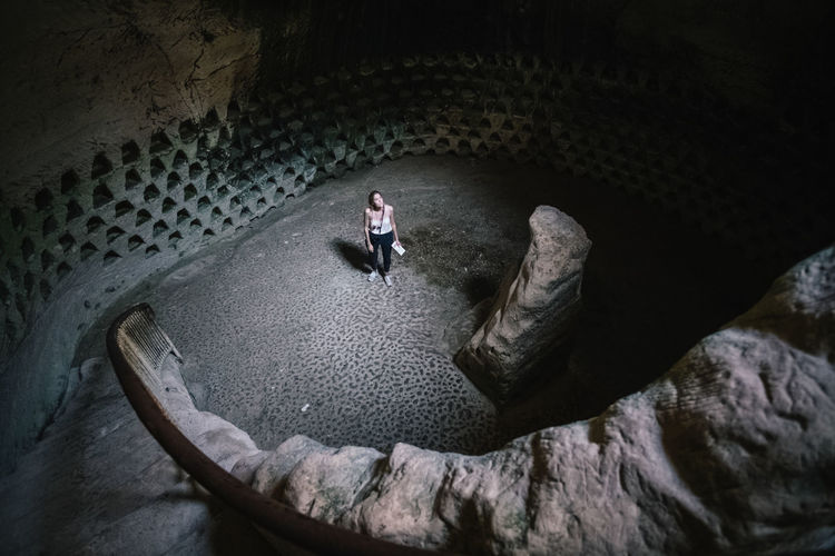 High angle view of woman standing on rock