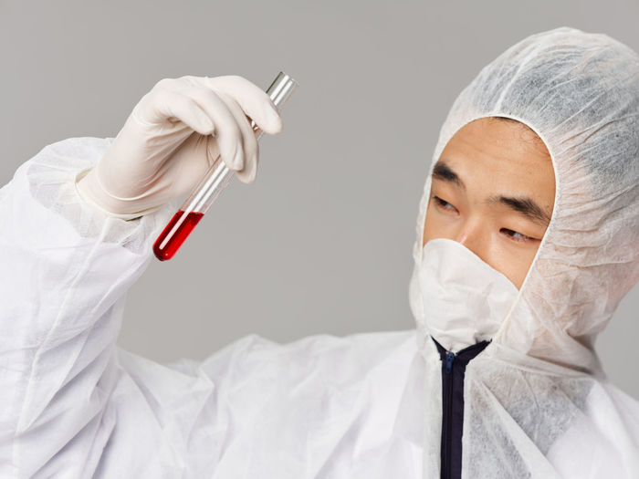Doctor holding tube at laboratory