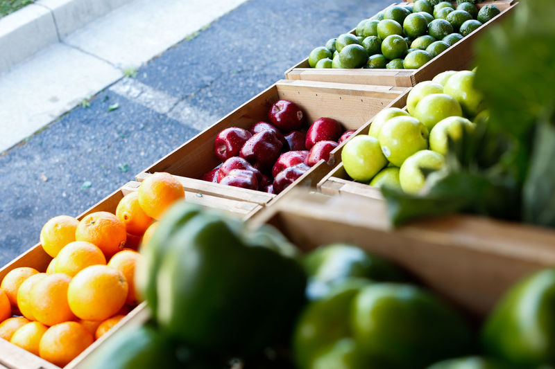 High angle view of various fruits and vegetable for sale at market stall