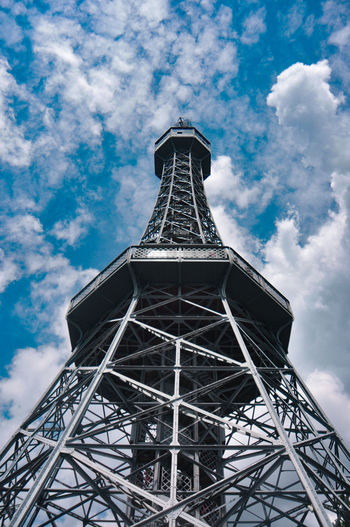 Low angle view of tower against cloudy sky