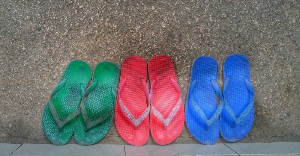 Colorful slippers. is the angle lying on the groubd or is it on wall