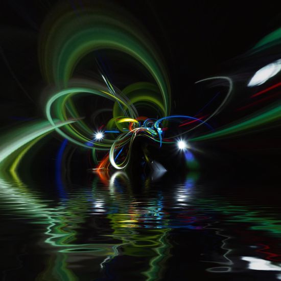 Digital composite image of light trails in water at night