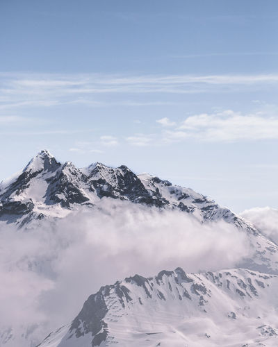 Scenic view of snowcapped mountains against sky
