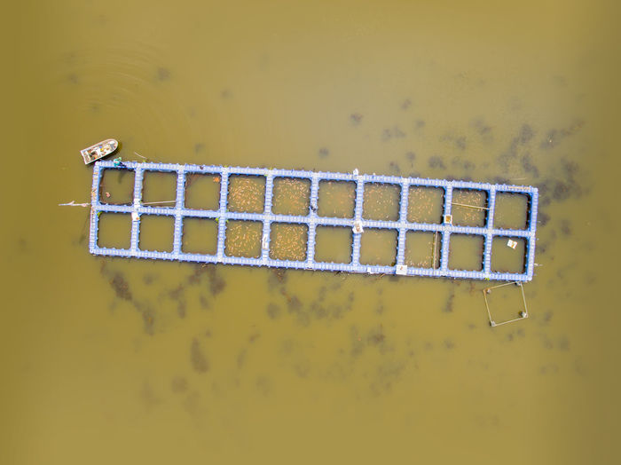 Aerial view of traditional fishing cage in river