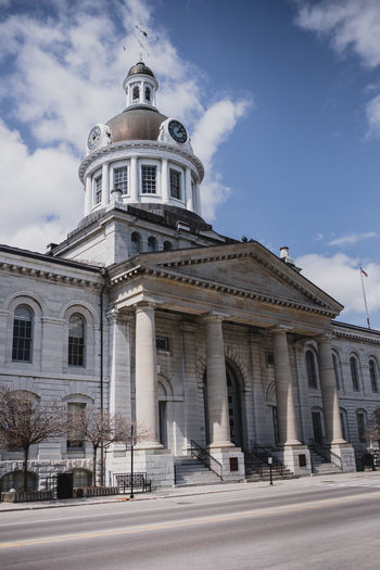 Kingston city hall building on an empty street on spring day.