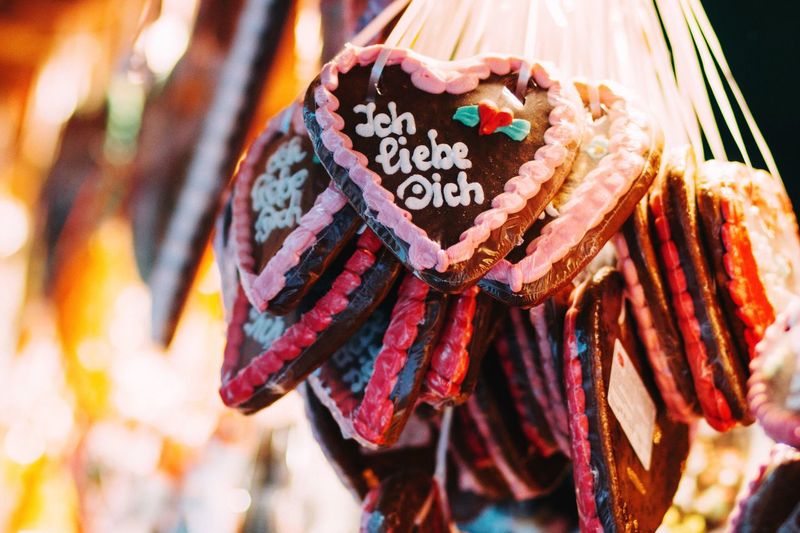 Close-up of gingerbread cookies hanging at market for sale