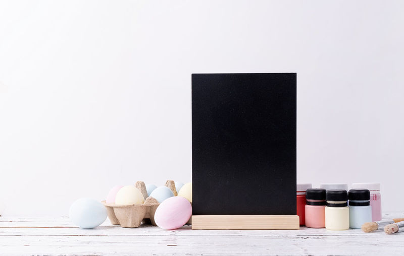 Laptop on table against white background