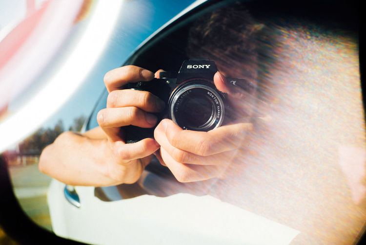 Close-up of hand holding camera