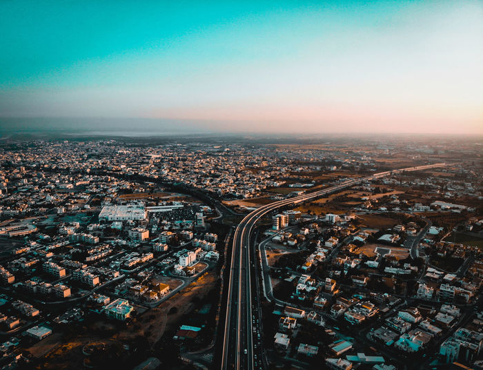 Aerial view of city buildings against sky