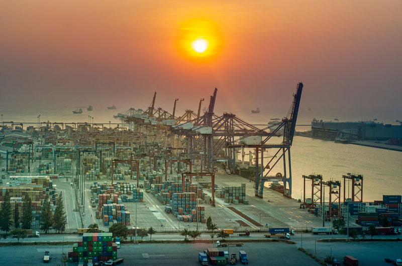 View of harbor against sky during sunset