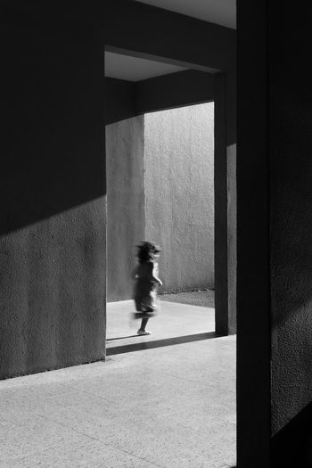 Child running below building