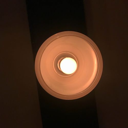 Low angle view of illuminated light bulb