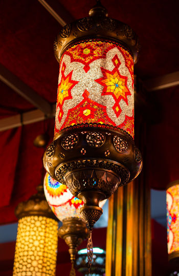 Low angle view of illuminated lantern hanging in temple