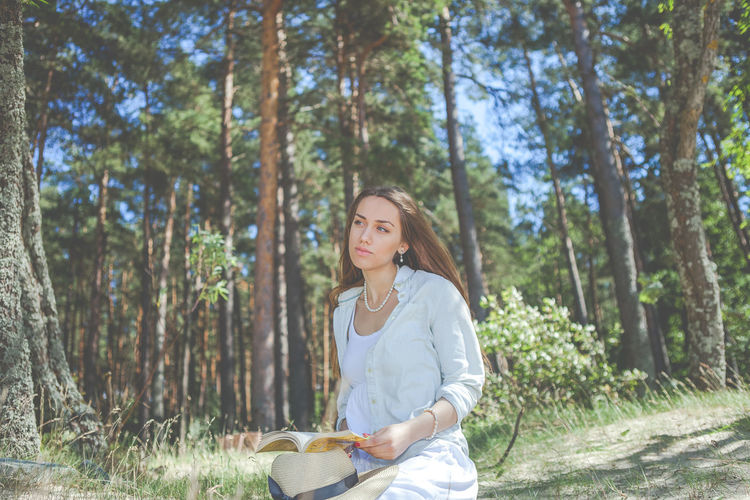 Portrait of young woman in forest