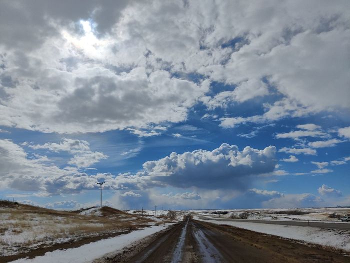 Beautiful sky and a muddy dirt road
