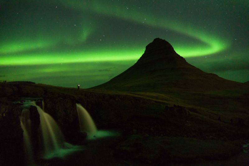 Scenic view of mountain against sky at night