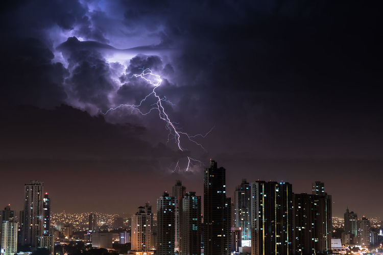 Lightning over cityscape at night