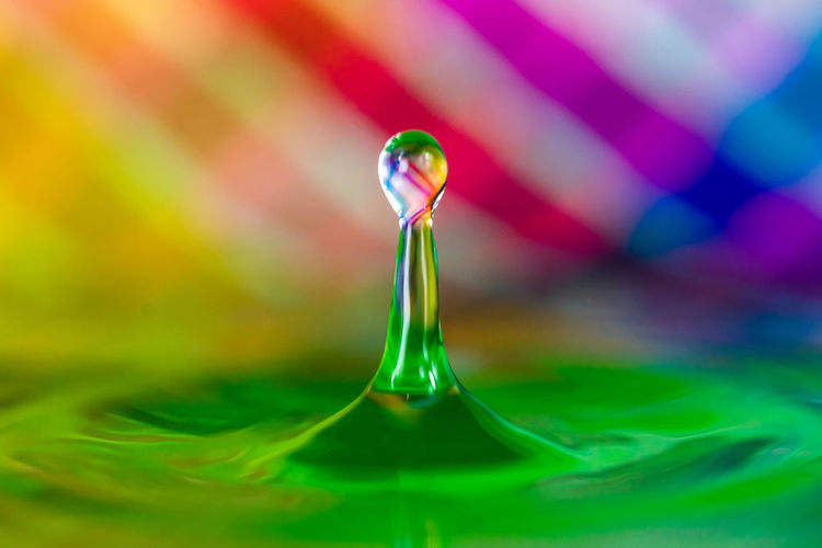 Close-up of water drop on glass
