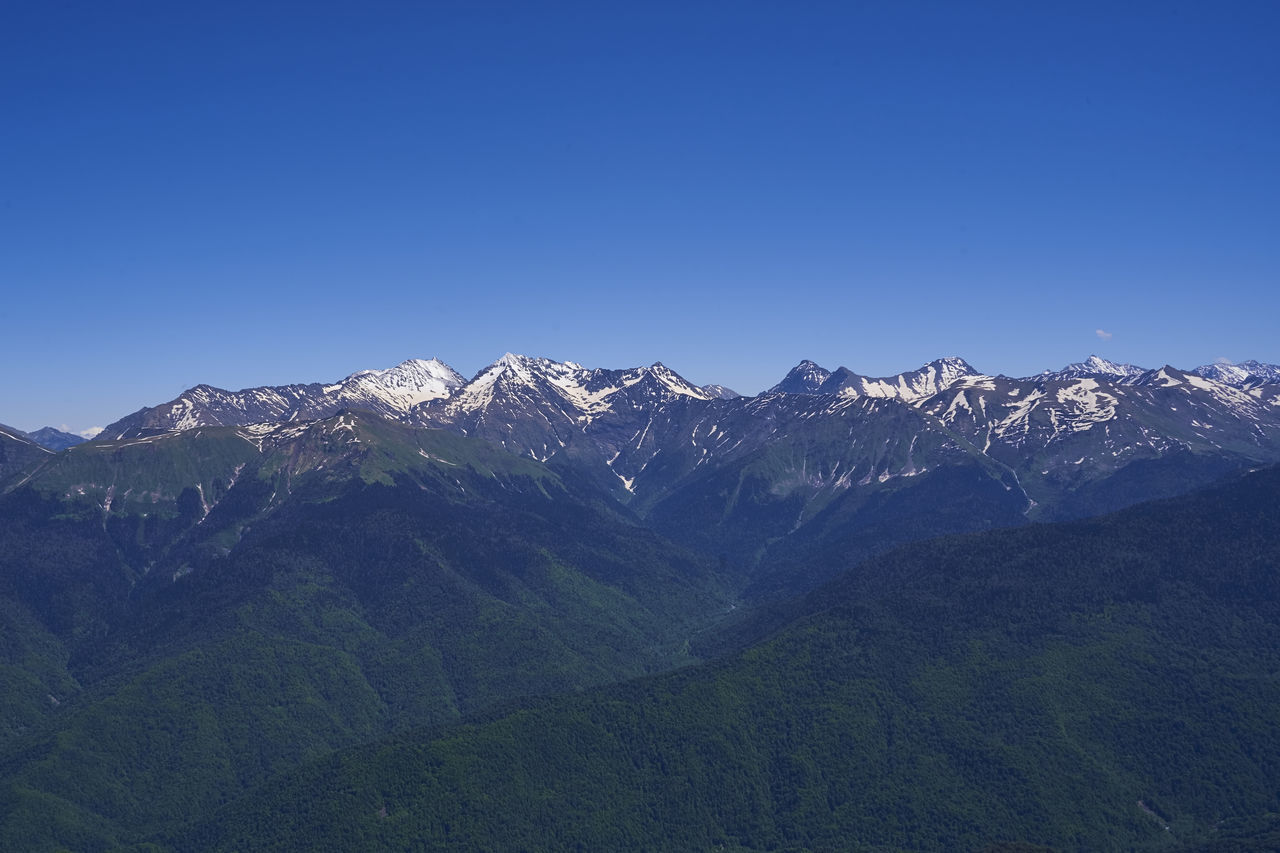 SCENIC VIEW OF MOUNTAIN RANGE AGAINST CLEAR BLUE SKY