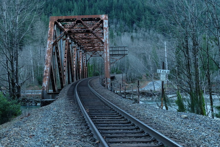 Railroad bridge across the skykomish river in a mountain town