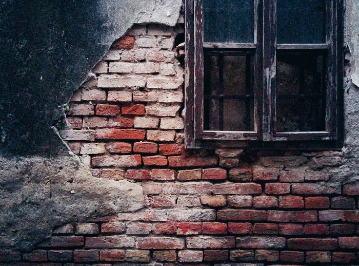 Close-up of window on brick wall
