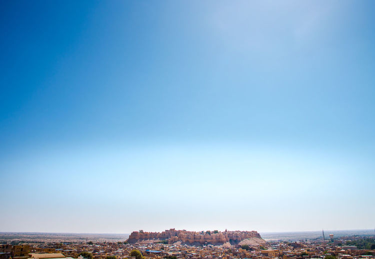 Jaisalmer fort and townscape against clear blue sky