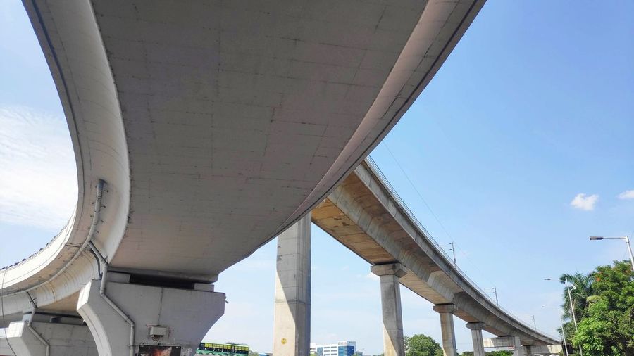 Low angle view of elevated road against sky