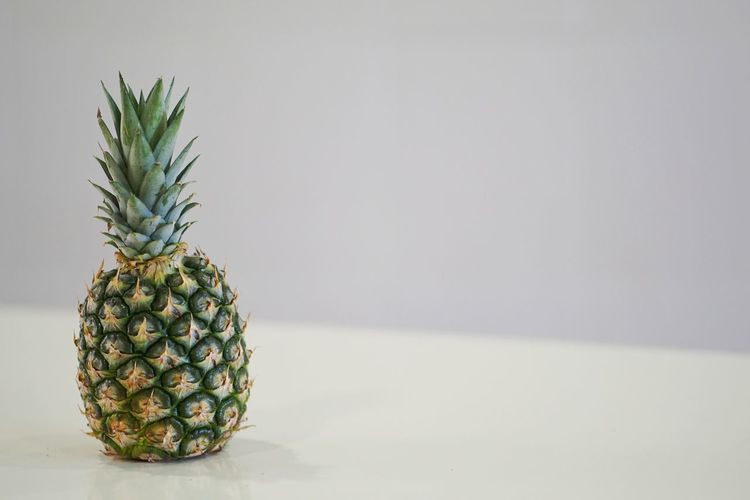 Close-up of fruit against white background