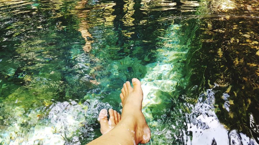 Low section of woman in river