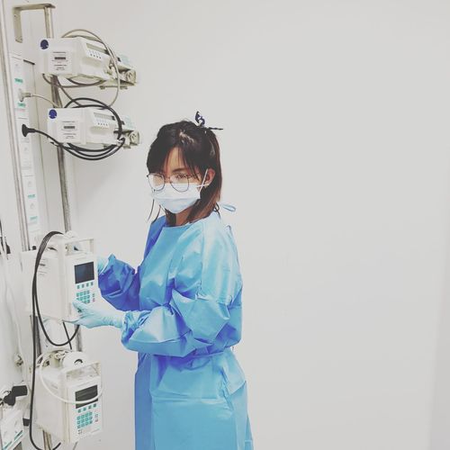 Female doctor with medical equipment in hospital