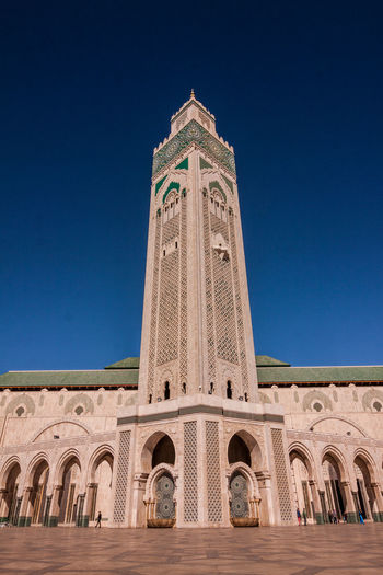 Low angle view of hassan ii mosque against sky