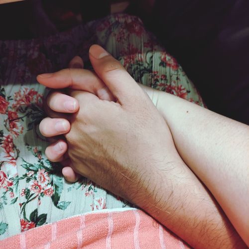 Couple hand holding, warm and romantic love pictured