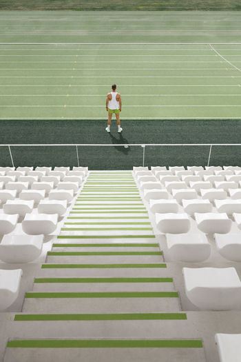 Athlete standing on running track at sports field