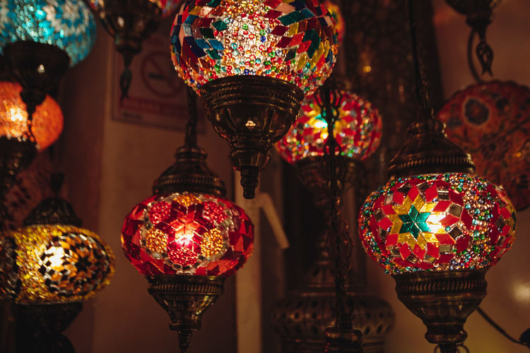 Low angle view of illuminated lanterns hanging in market